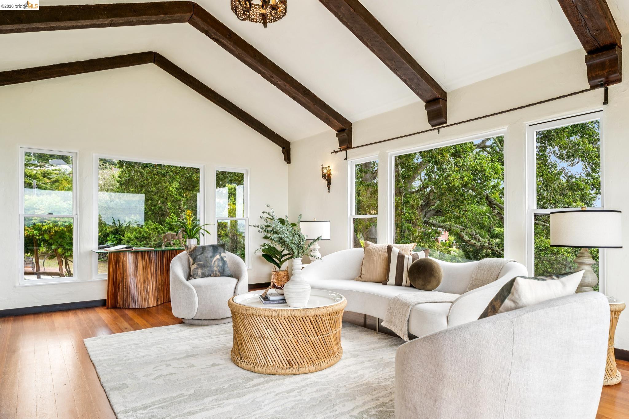 784 Cragmont Avenue Berkeley, CA 94708 - Photo 19 of 64 Vaulted ceiling with dark wood beams and a decorative chandelier