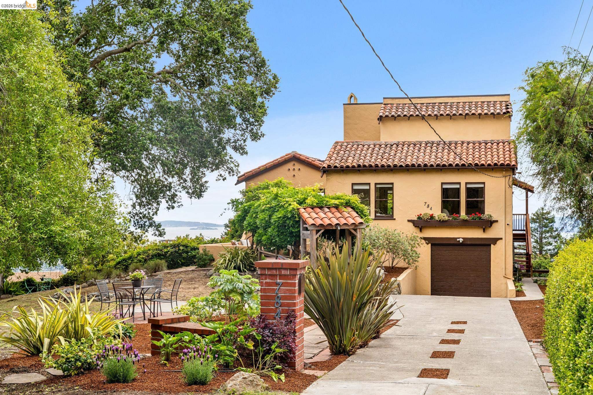 784 Cragmont Avenue Berkeley, CA 94708 - Photo 3 of 64 Stucco exterior featuring a tiled roof and brown garage door