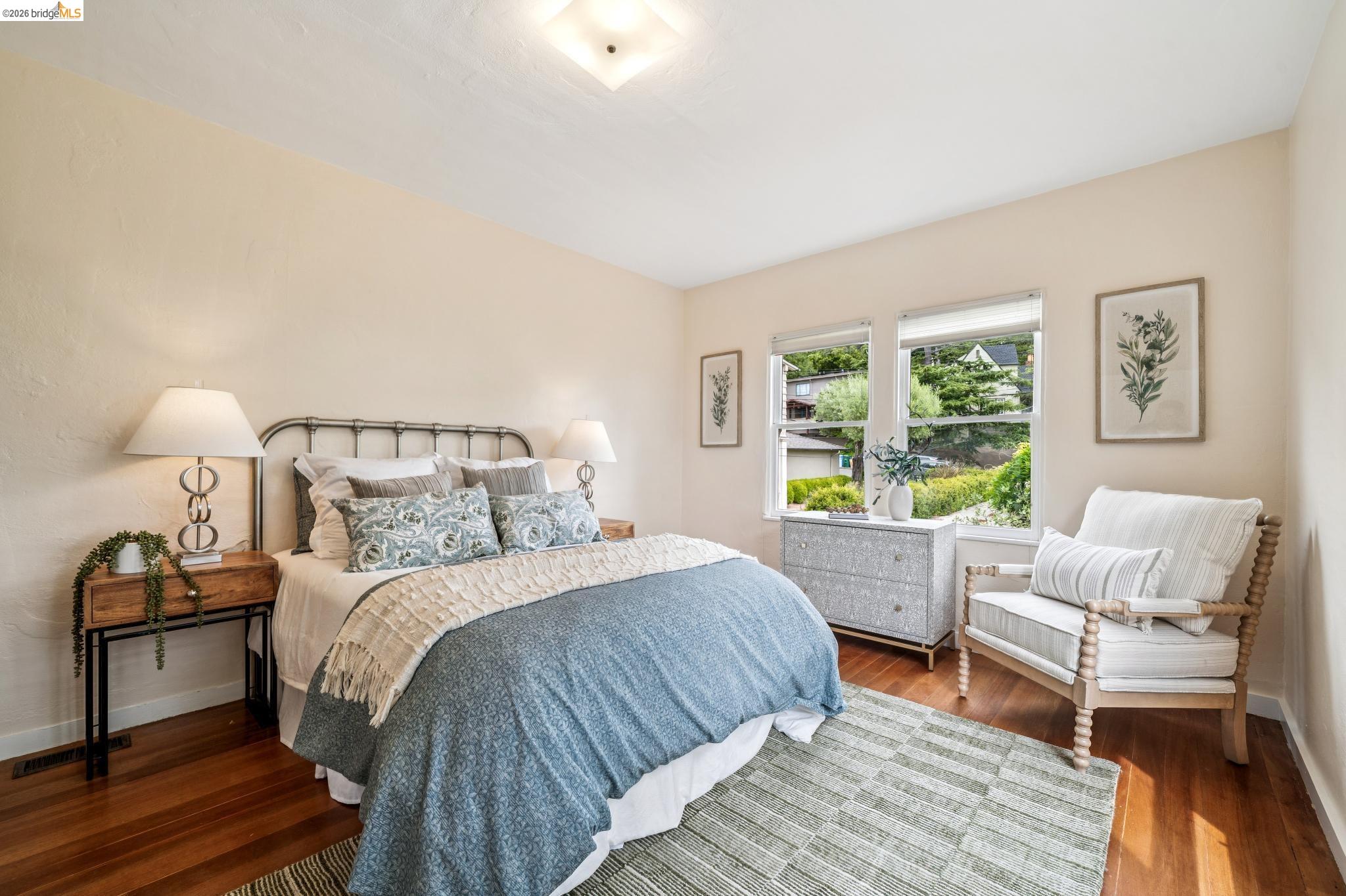 784 Cragmont Avenue Berkeley, CA 94708 - Photo 41 of 64 Warm wood flooring extends throughout this room, featuring light-toned walls and a textured ceiling