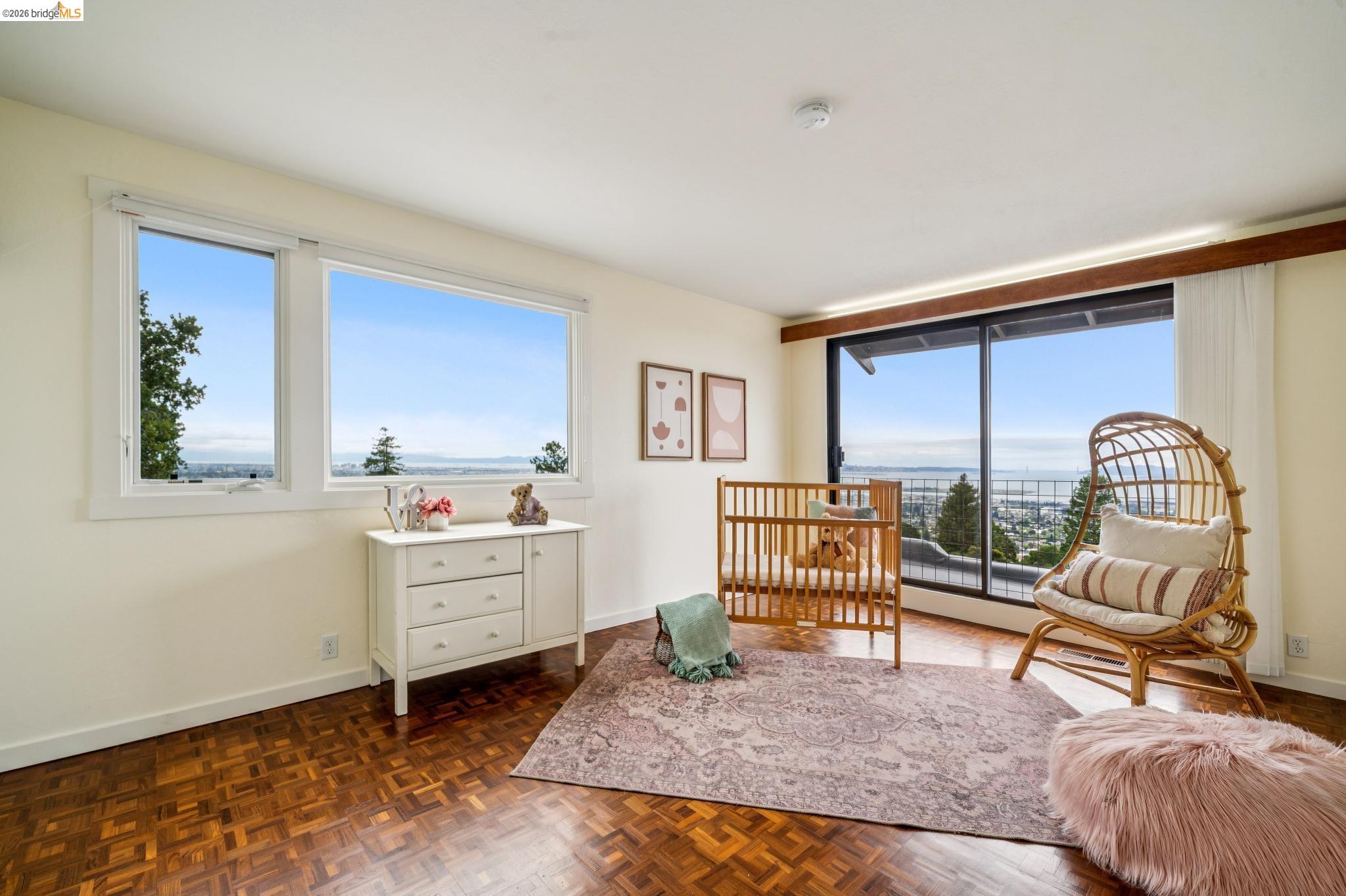 784 Cragmont Avenue Berkeley, CA 94708 - Photo 55 of 64 Interior space featuring parquet wood-finish flooring, white walls, and large windows