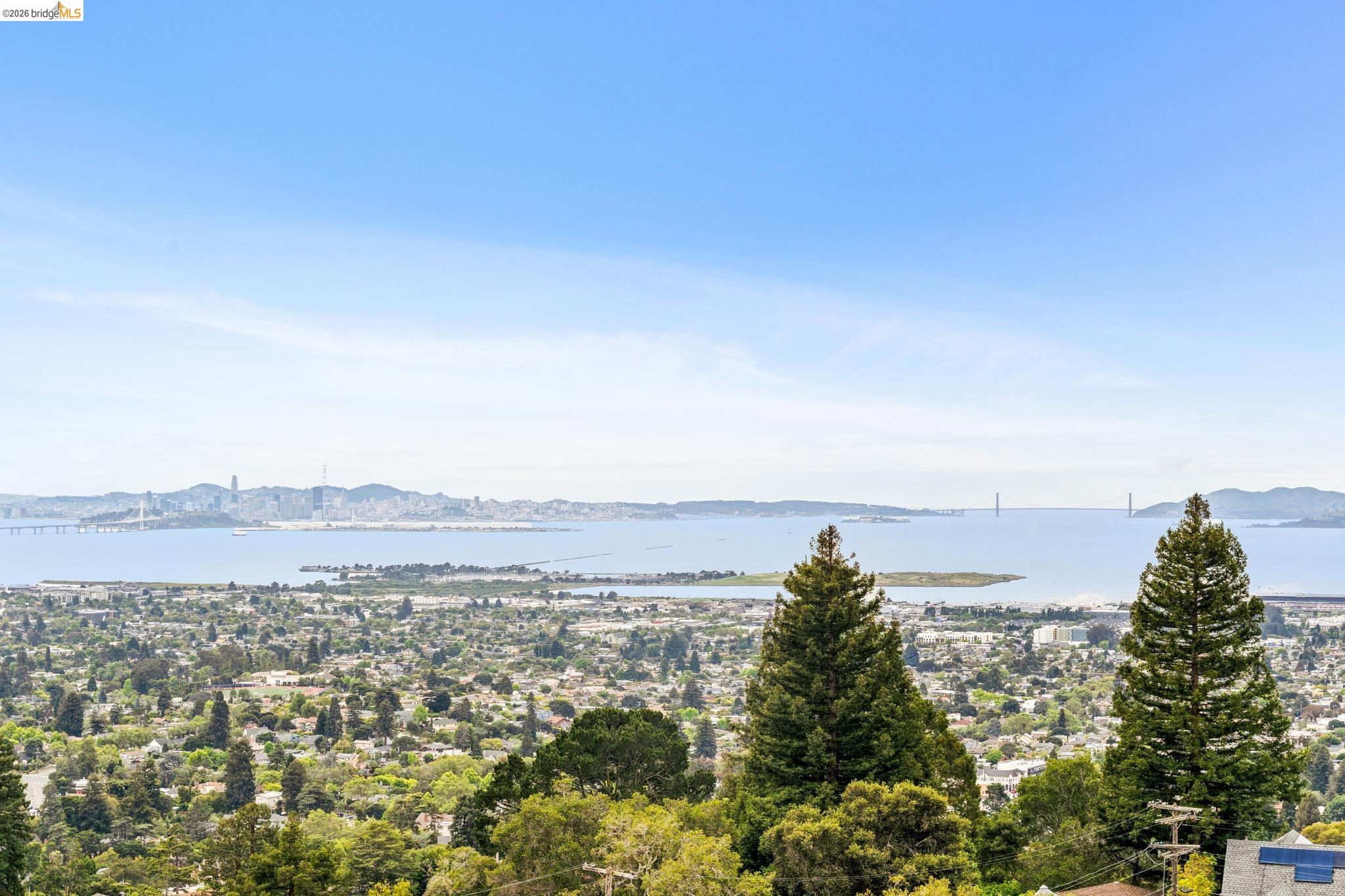 784 Cragmont Avenue Berkeley, CA 94708 - Photo 58 of 64 Expansive water and city skyline panorama with distant bridge structures