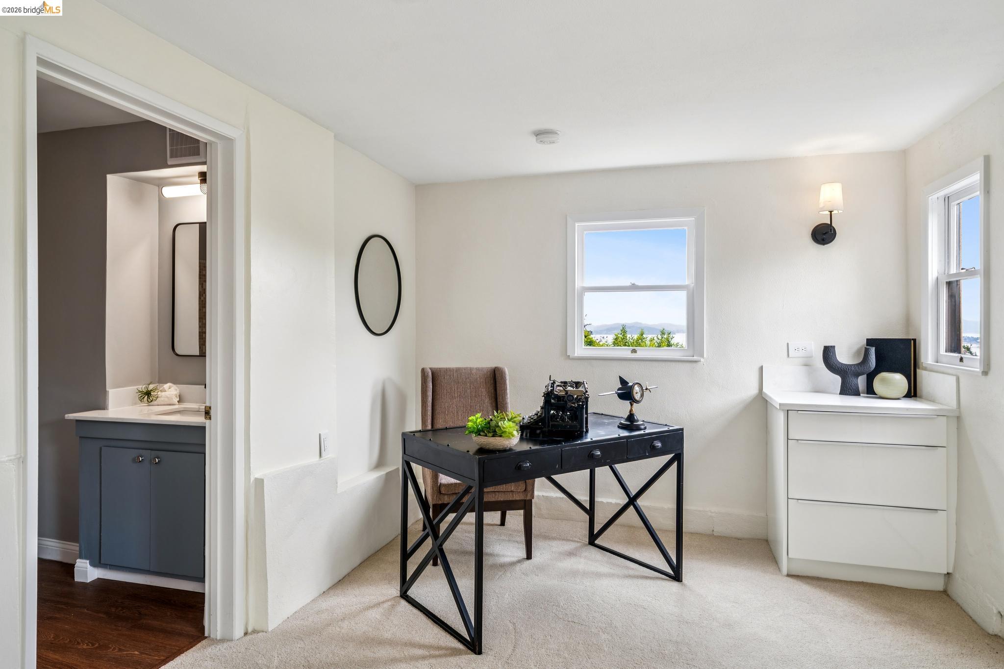 784 Cragmont Avenue Berkeley, CA 94708 - Photo 61 of 64 Bright room featuring dual windows, carpet flooring, and a built-in three-drawer cabinet with a light-toned countertop