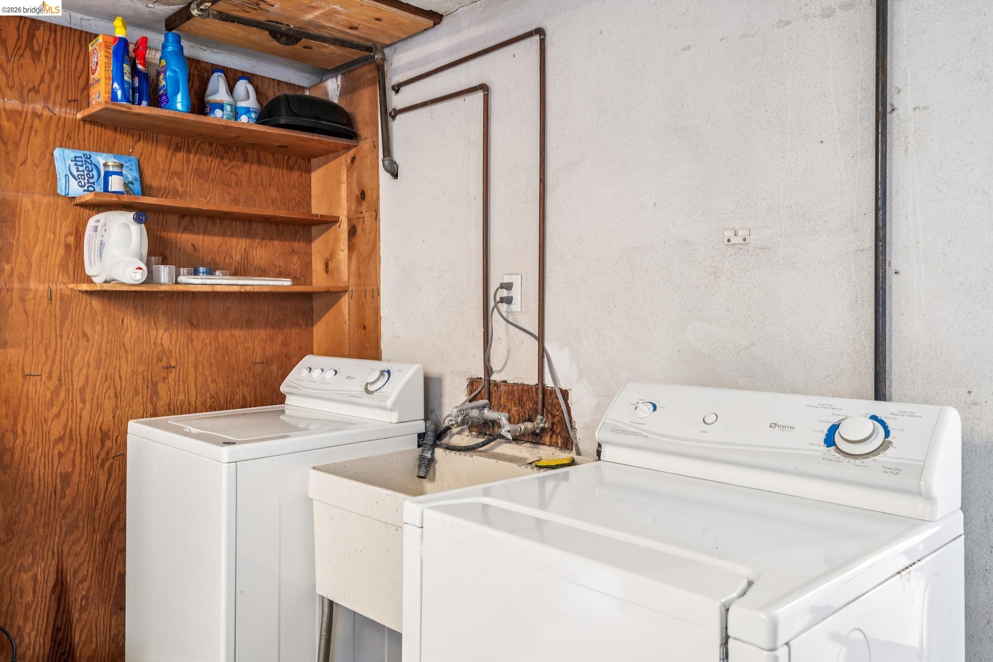 784 Cragmont Avenue Berkeley, CA 94708 - Photo 63 of 64 Dedicated laundry area featuring a utility sink, a top-load washing machine, and a front-load dryer