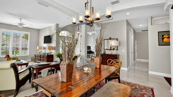 a spacious bathroom with a granite countertop sink a toilet a mirror and shower