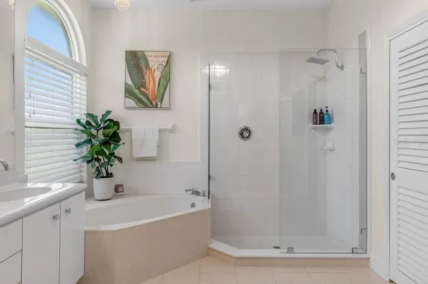 a living room with a fireplace and a large window