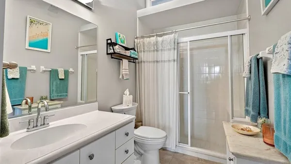 a kitchen with stainless steel appliances a refrigerator stove and microwave