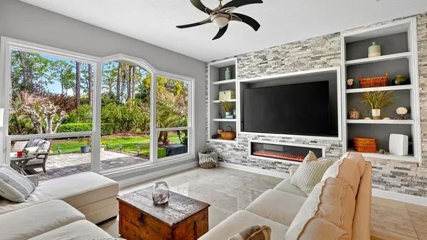 an aerial view of residential house with outdoor space and swimming pool