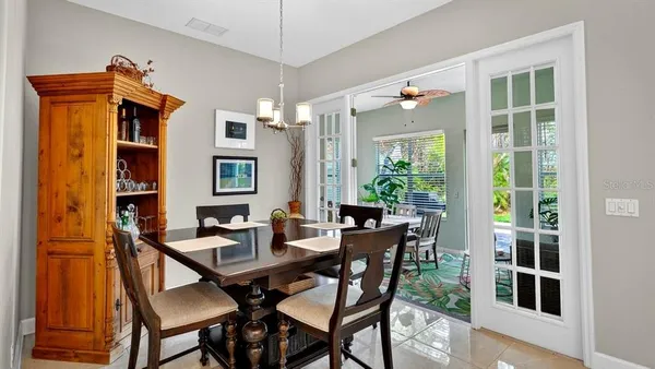 a view of a roof deck with furniture and a lake view