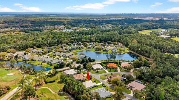 a view of swimming pool with outdoor seating and city view