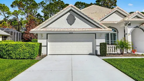 a front view of a house with large windows