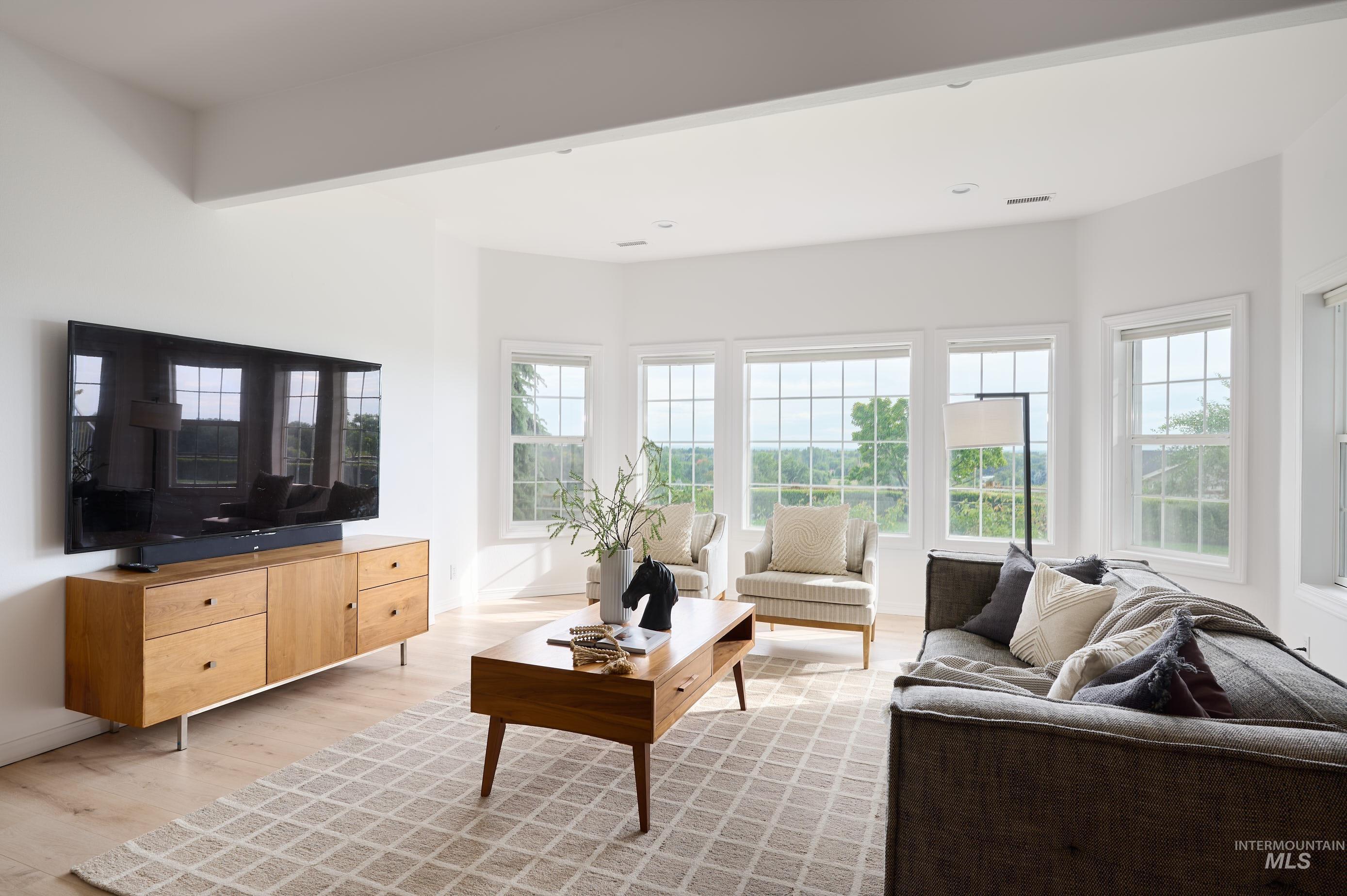 3931 North Triple Ridge Place Eagle, ID 83616 - Photo 22 of 45 Living area featuring light wood finished floors and recessed lighting