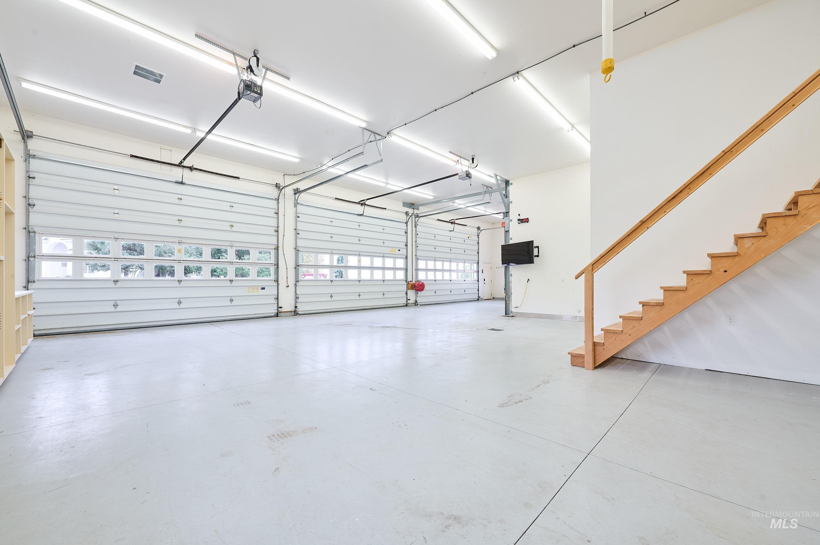 3931 North Triple Ridge Place Eagle, ID 83616 - Photo 32 of 45 Garage featuring a garage door opener