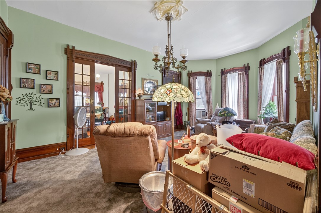 51 Seneca Street Starkey, NY 14837 - Photo 11 of 41 large family room leading to the front parlor