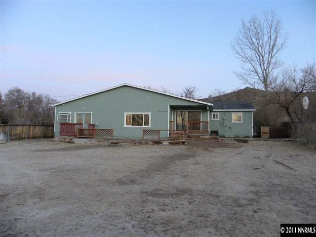 8585 Aquifer Way Reno, NV 89506 - Photo 12 of 12 a view of a house with a backyard