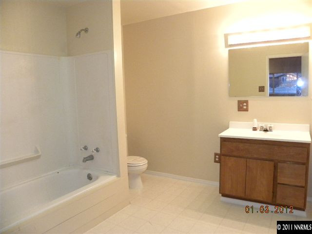 8585 Aquifer Way Reno, NV 89506 - Photo 10 of 12 a bathroom with a sink a toilet and shower