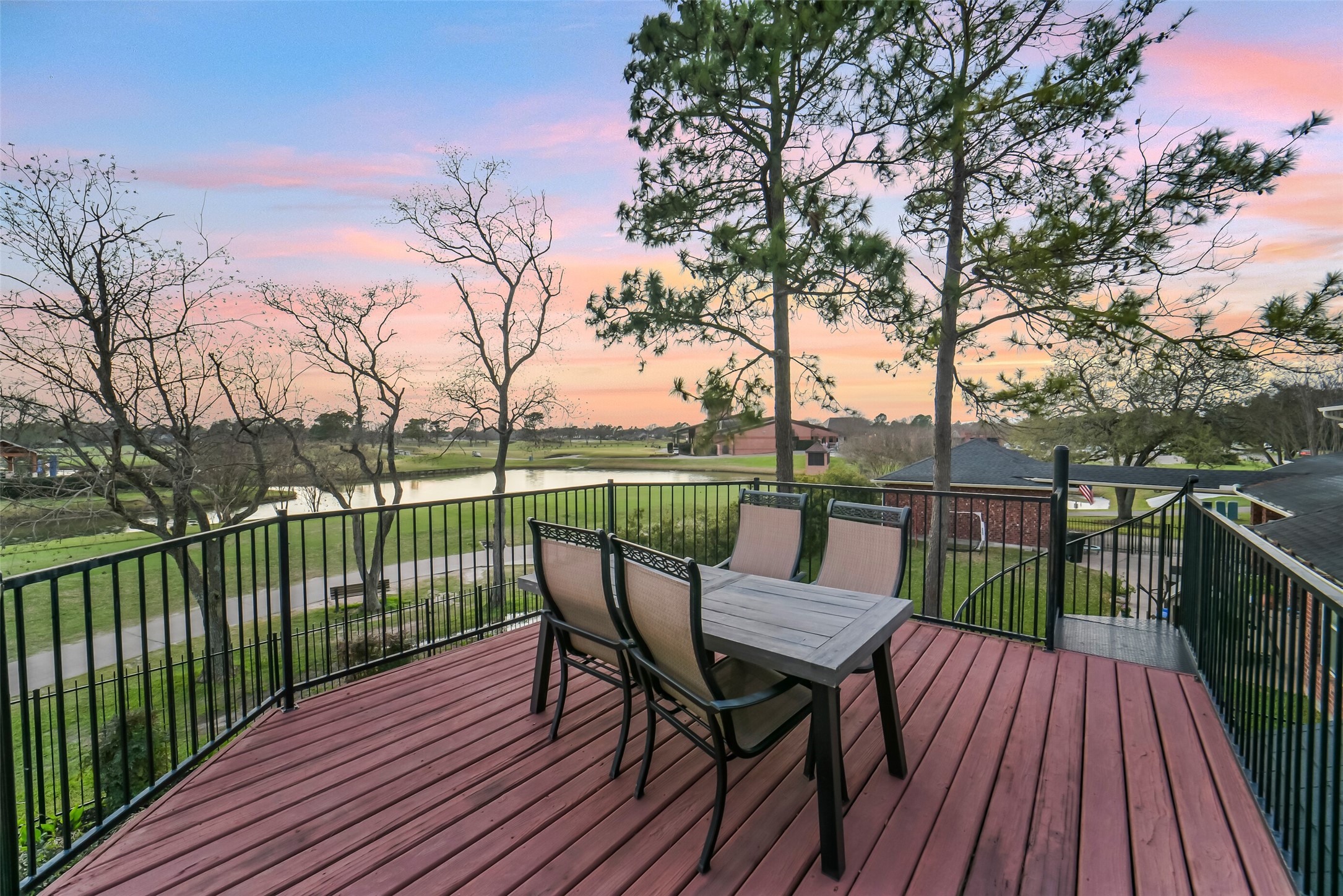 24403 Falcon Point Drive Katy, TX 77494 - Photo 30 of 32 Large second-story balcony overlooking the lake with a convenient spiral staircase for direct backyard access.
