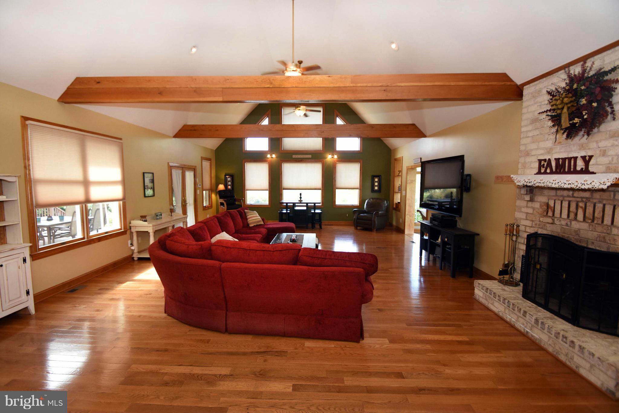 712 Connolly Farms Road Fallston, MD 21047 - Photo 15 of 30 a living room with furniture a fireplace and a large window