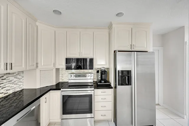 a very nice looking dining room with a table and chairs