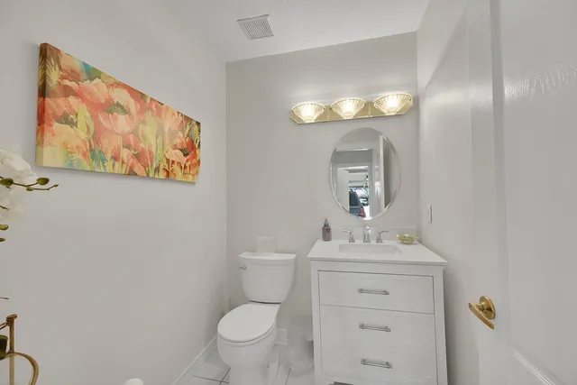 a view of a patio with a table and chairs under an umbrella