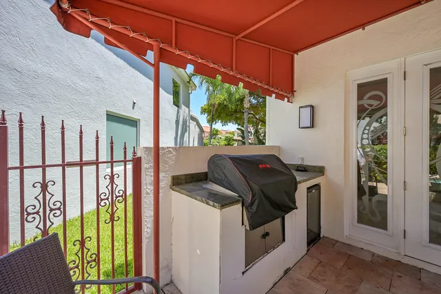 a view of a chairs and table in patio