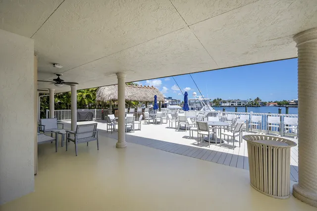 an aerial view of residential houses with outdoor space and river