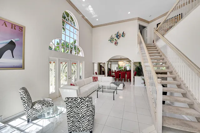 a living room with furniture and a rug
