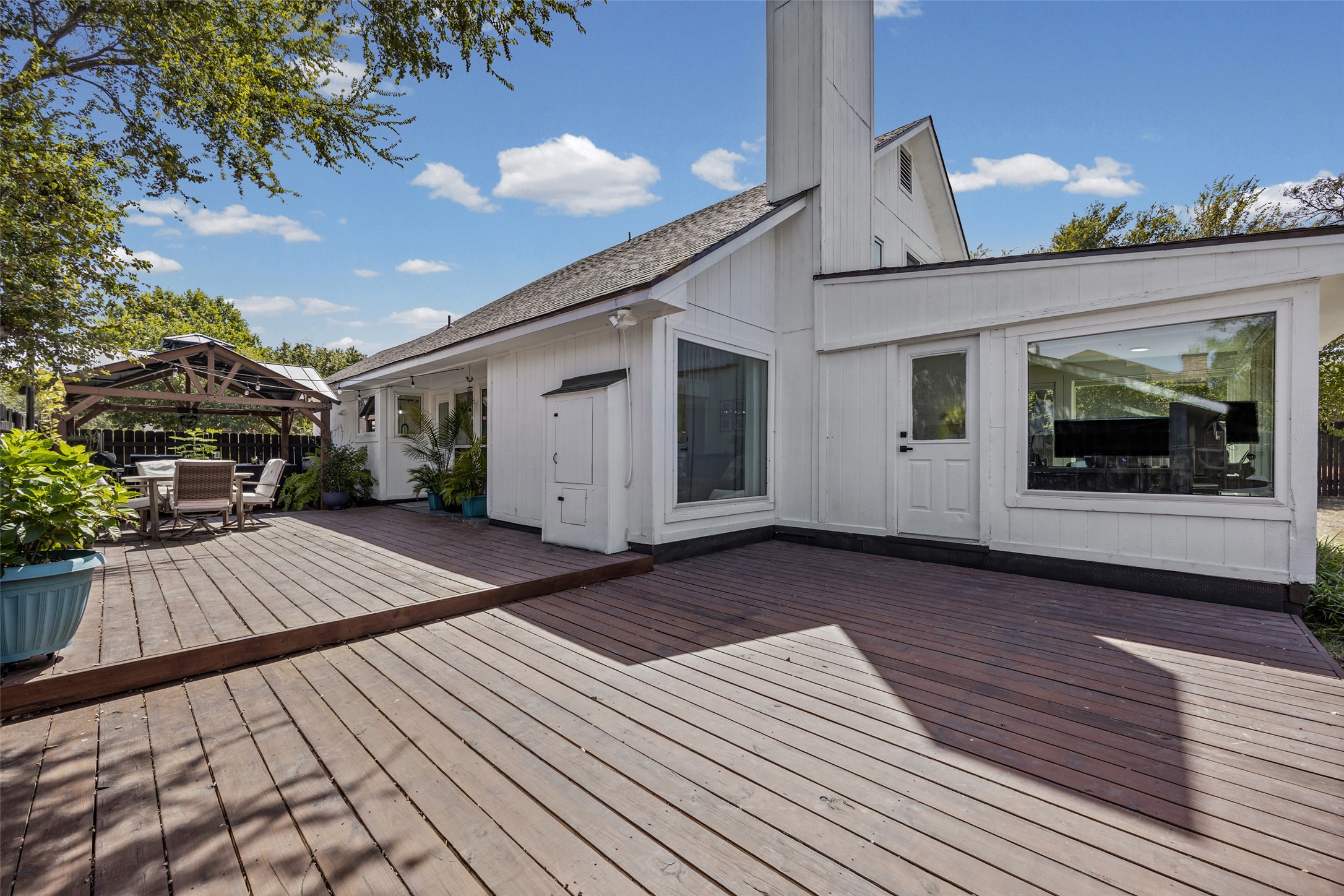 3006 Overland Street Round Rock, TX 78681 - Photo 21 of 29 A spacious multi-level wooden deck opens up to the backyard of this two-story home.