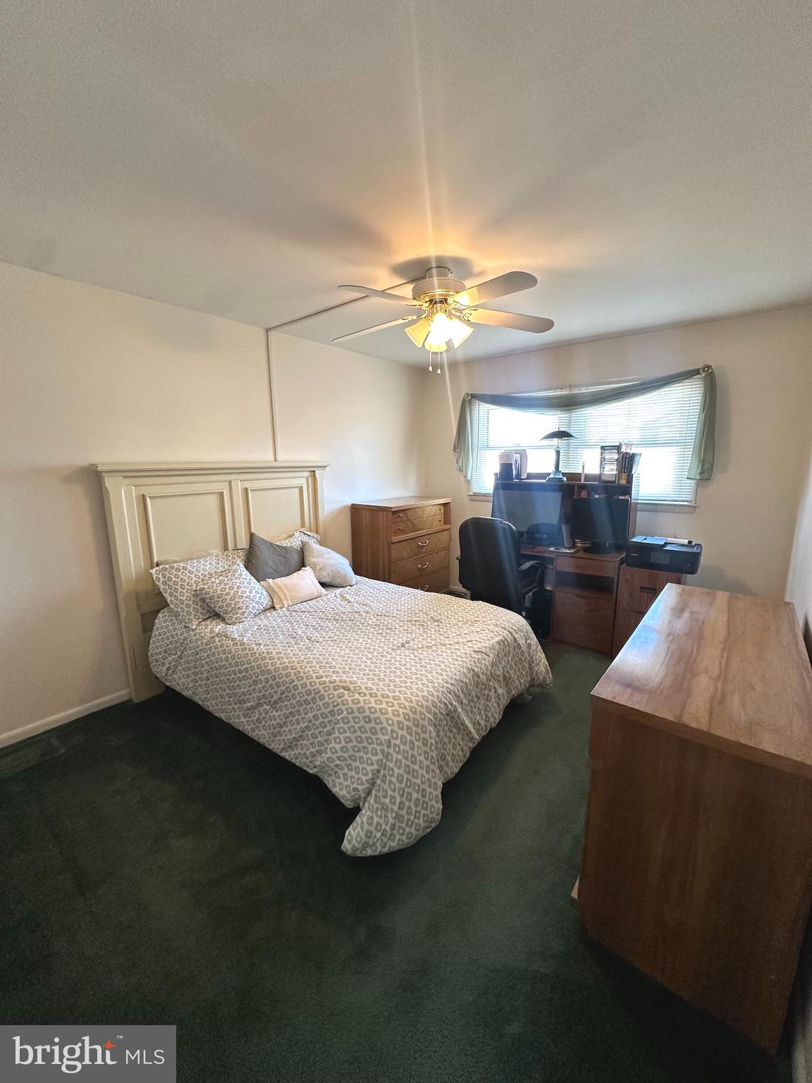 118 Spring House Road Cherry Hill, NJ 08002 - Photo 14 of 19 a bedroom with a bed and a chandelier