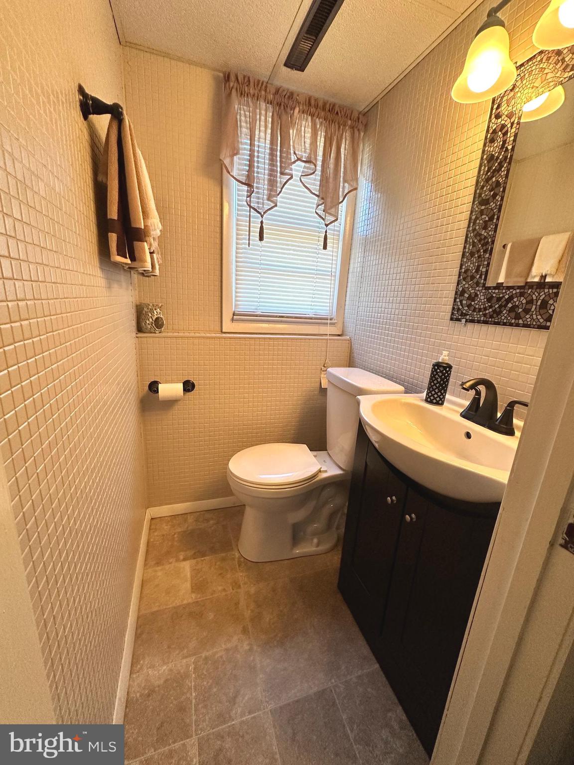 118 Spring House Road Cherry Hill, NJ 08002 - Photo 18 of 19 a bathroom with a toilet sink and mirror
