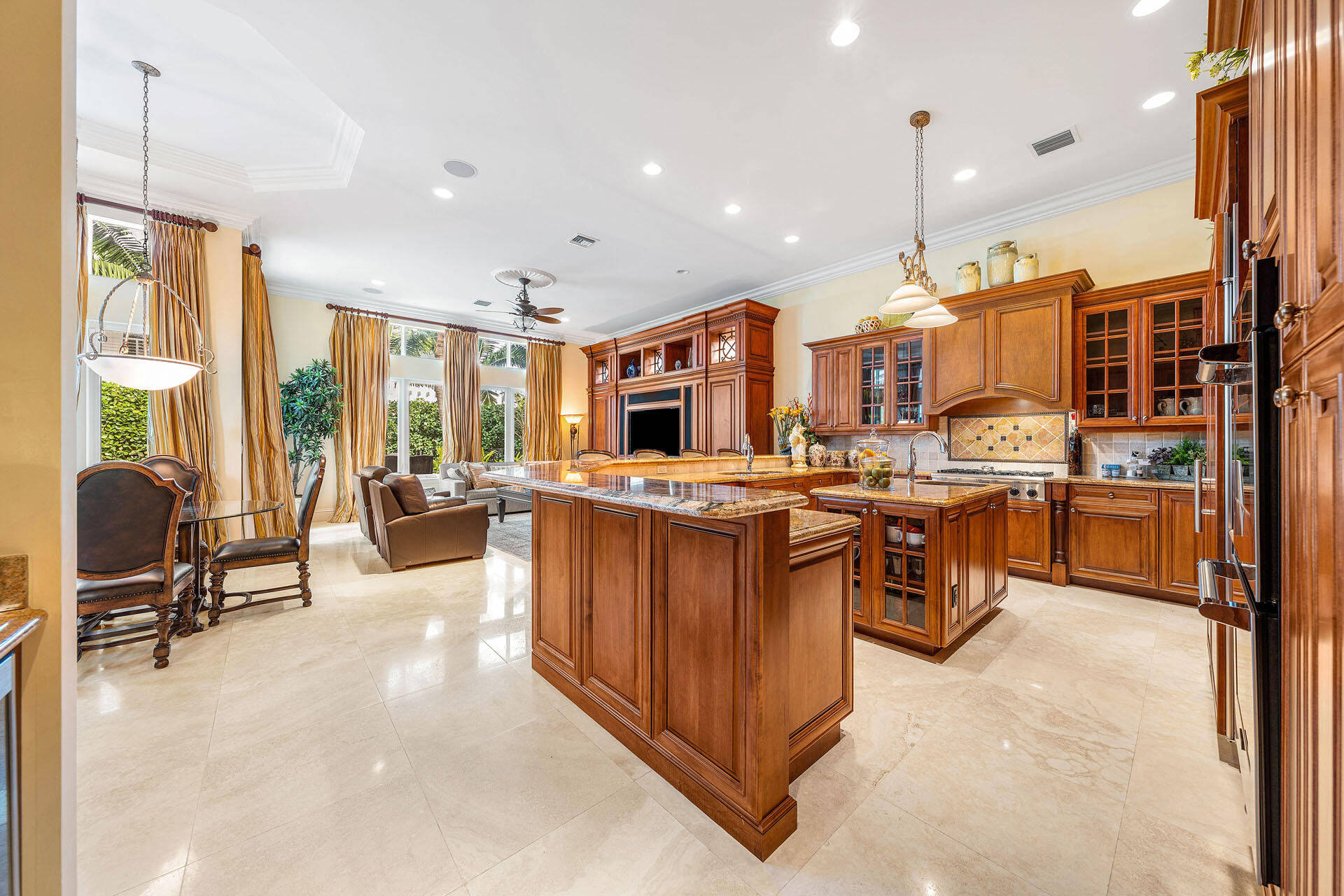 2386 West Maya Palm Drive Boca Raton, FL 33432 - Photo 16 of 76 a kitchen with stainless steel appliances kitchen island granite countertop a stove a sink and a refrigerator