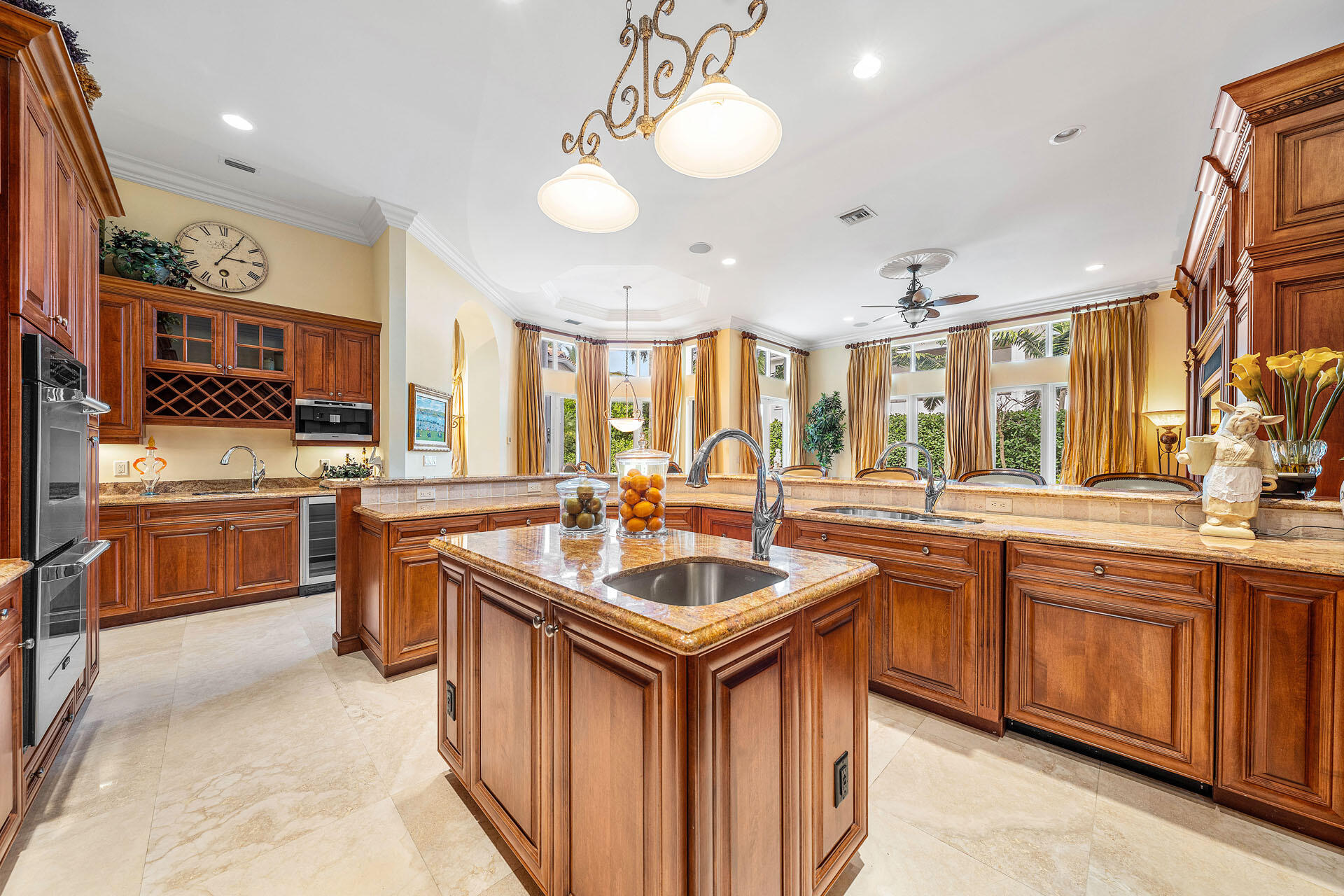 2386 West Maya Palm Drive Boca Raton, FL 33432 - Photo 18 of 76 a kitchen with stainless steel appliances granite countertop a sink and a stove