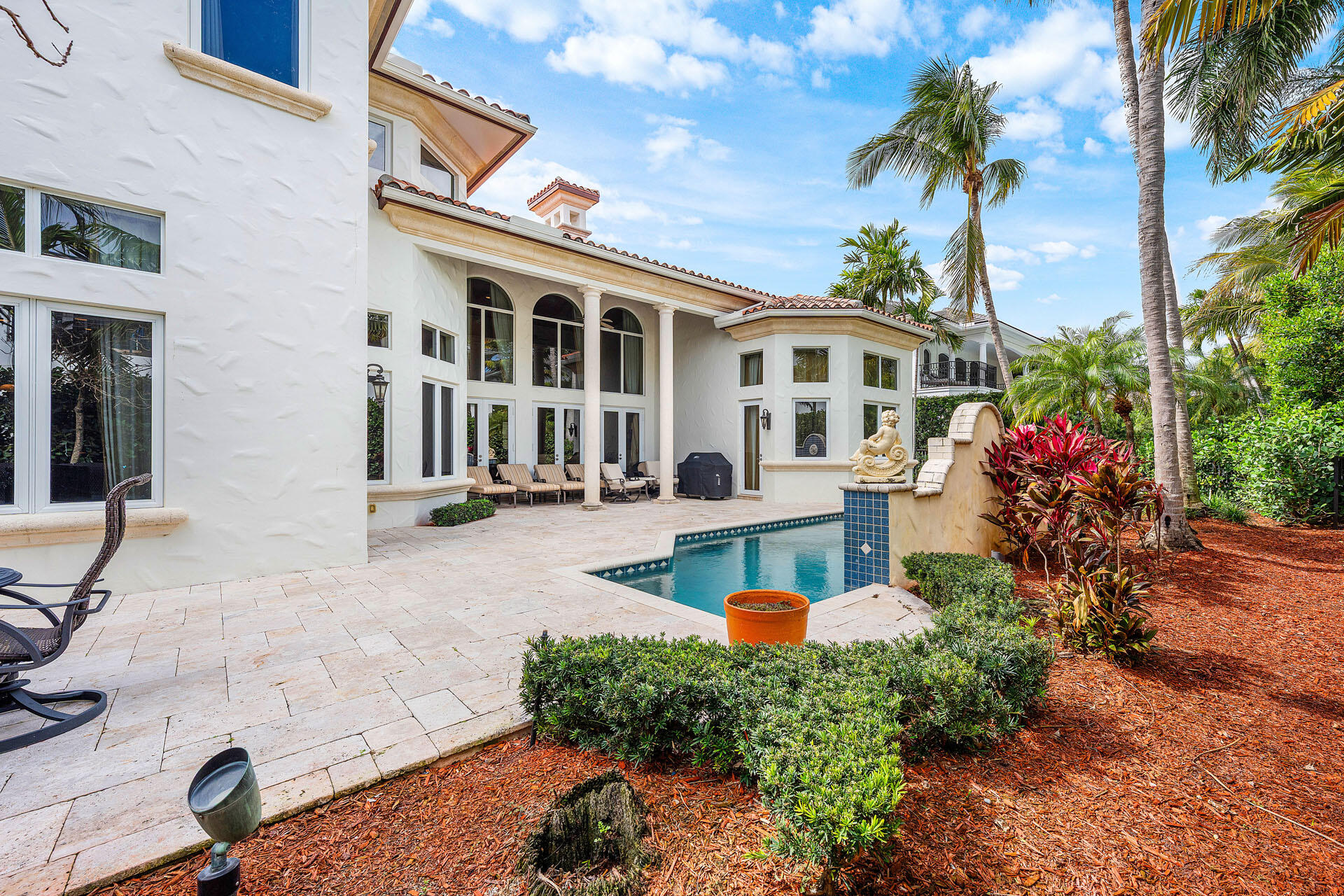2386 West Maya Palm Drive Boca Raton, FL 33432 - Photo 29 of 76 a front view of a house with a yard