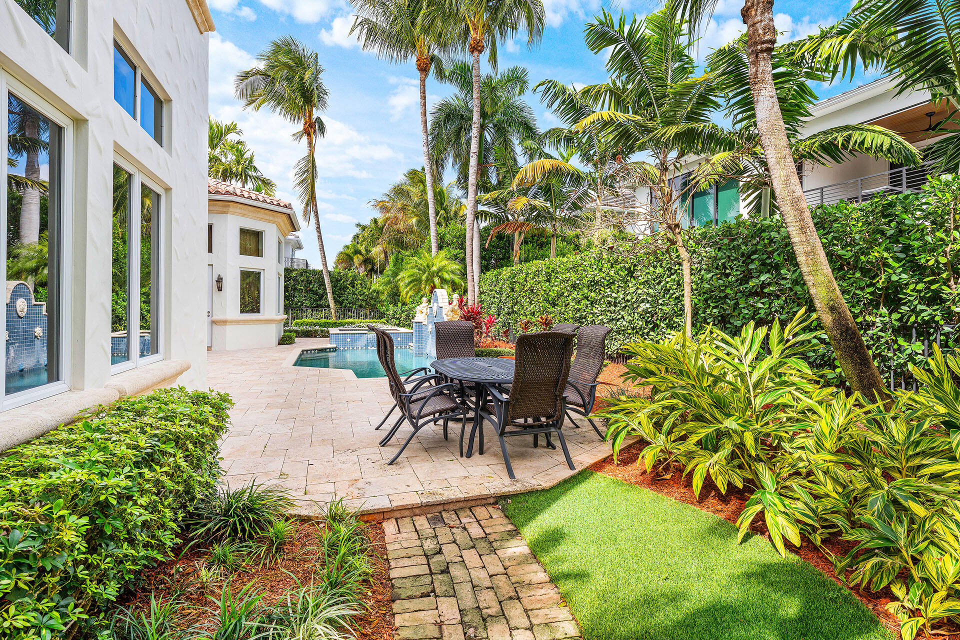2386 West Maya Palm Drive Boca Raton, FL 33432 - Photo 30 of 76 a view of a patio with table and chairs and potted plants