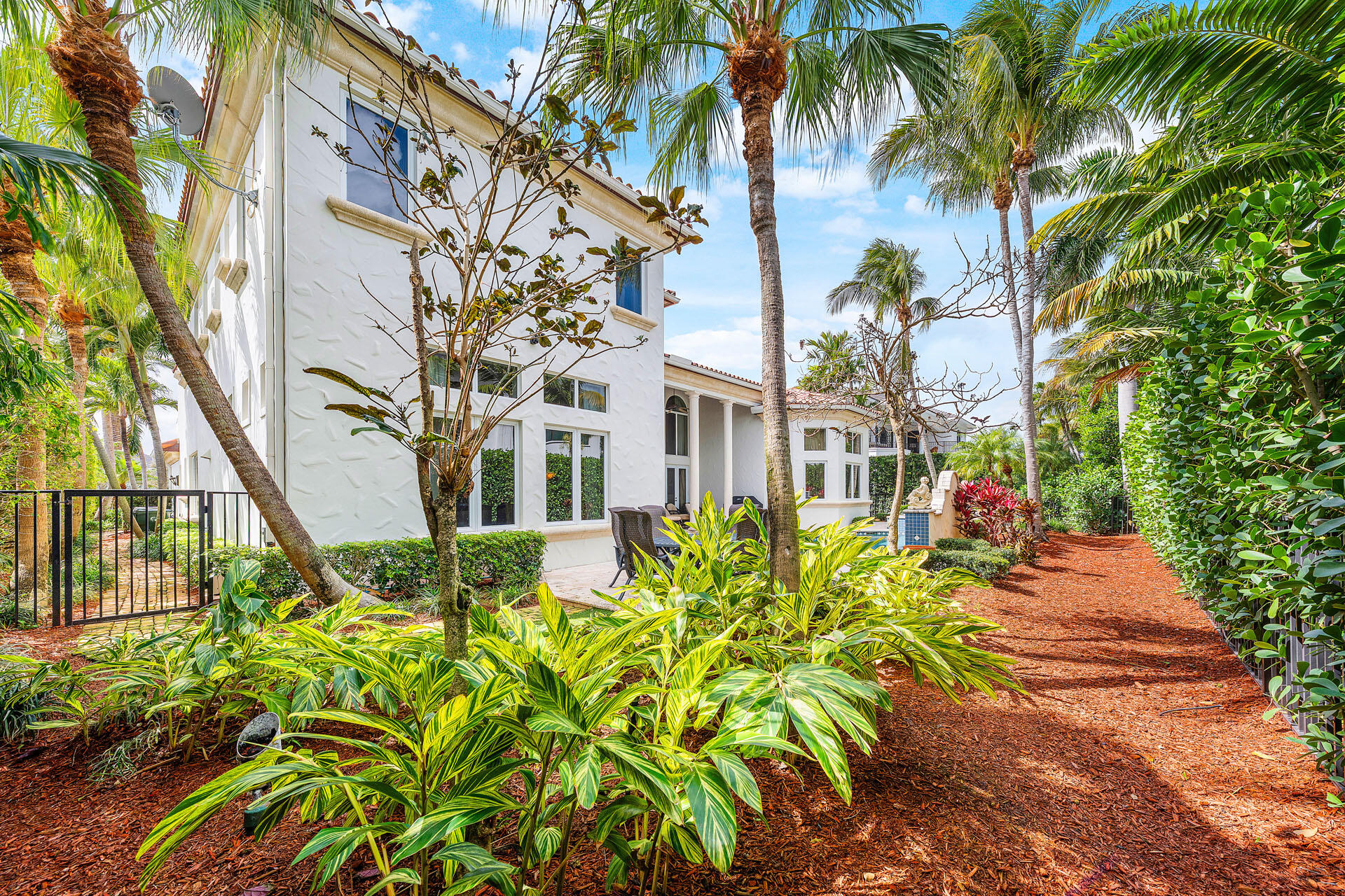 2386 West Maya Palm Drive Boca Raton, FL 33432 - Photo 32 of 76 a front view of a multi story residential apartment building with yard and entryway