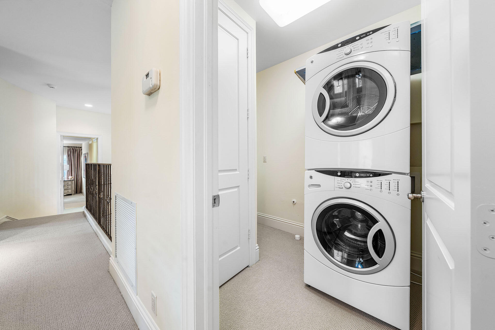 2386 West Maya Palm Drive Boca Raton, FL 33432 - Photo 54 of 76 a view of a hallway with washer and dryer