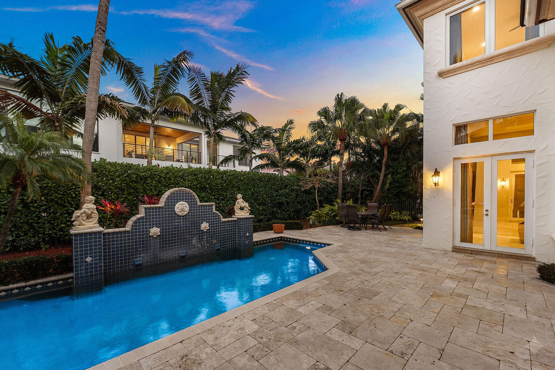 2386 West Maya Palm Drive Boca Raton, FL 33432 - Photo 65 of 76 a backyard of a house with wooden floor and outdoor seating