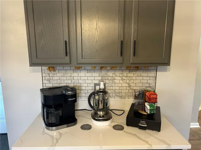 a kitchen with stainless steel appliances granite countertop a stove and a microwave