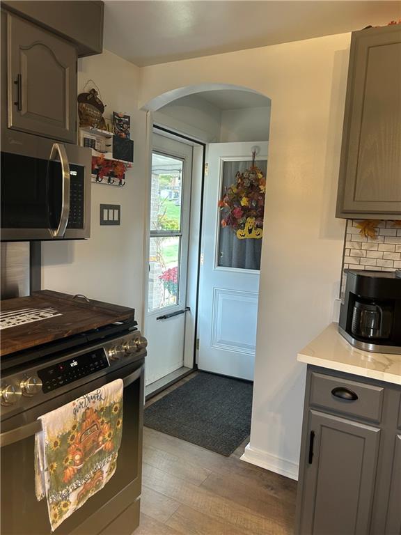 124 Giron Street Leechburg, PA 15656 - Photo 16 of 46 a kitchen with stainless steel appliances granite countertop a stove and a microwave