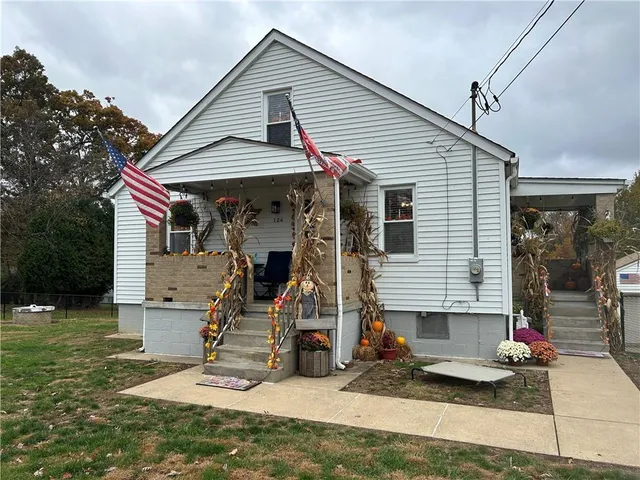 a view of house that has a yard