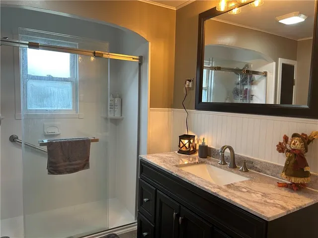 a white toilet sitting next to a bathroom sink
