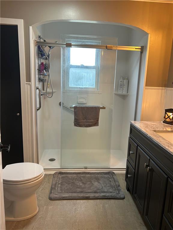 124 Giron Street Leechburg, PA 15656 - Photo 23 of 46 a bathroom with a granite countertop sink a toilet a shower and a mirror