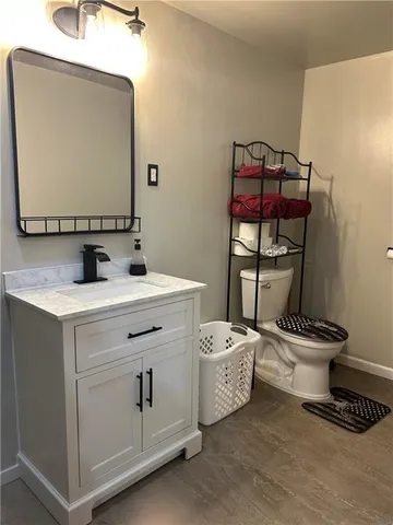 a kitchen with refrigerator and cabinets