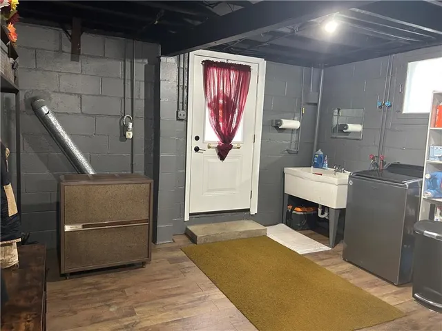 a view of a house with a yard and garage