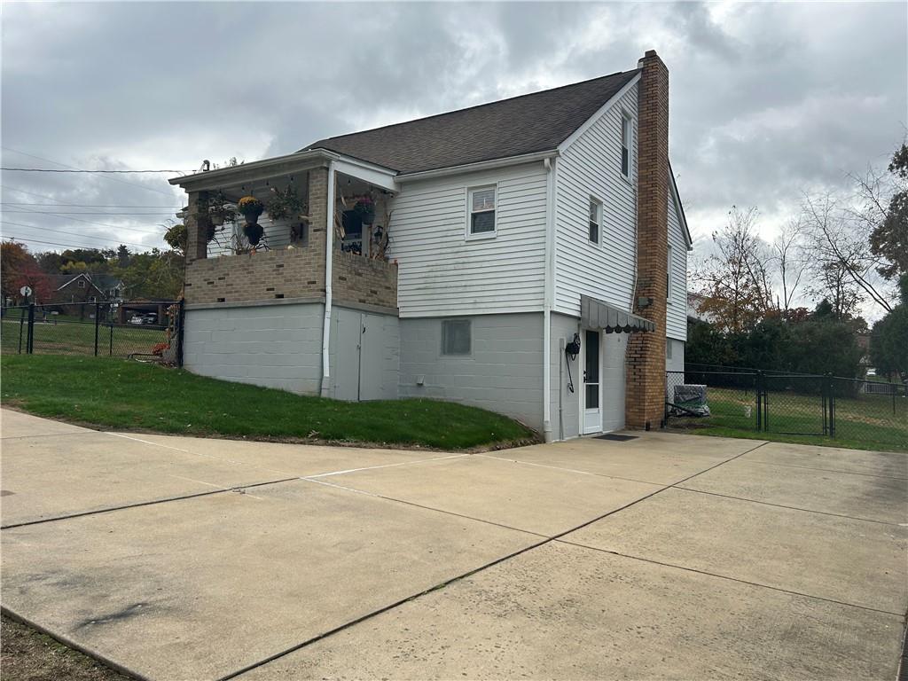 124 Giron Street Leechburg, PA 15656 - Photo 40 of 46 a view of a house with a yard and garage