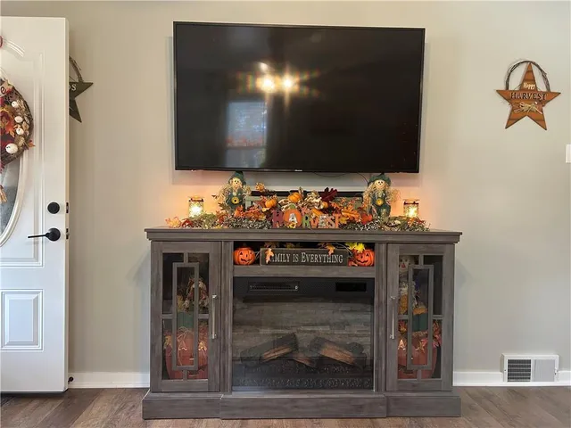 a living room with furniture a couch and a dresser