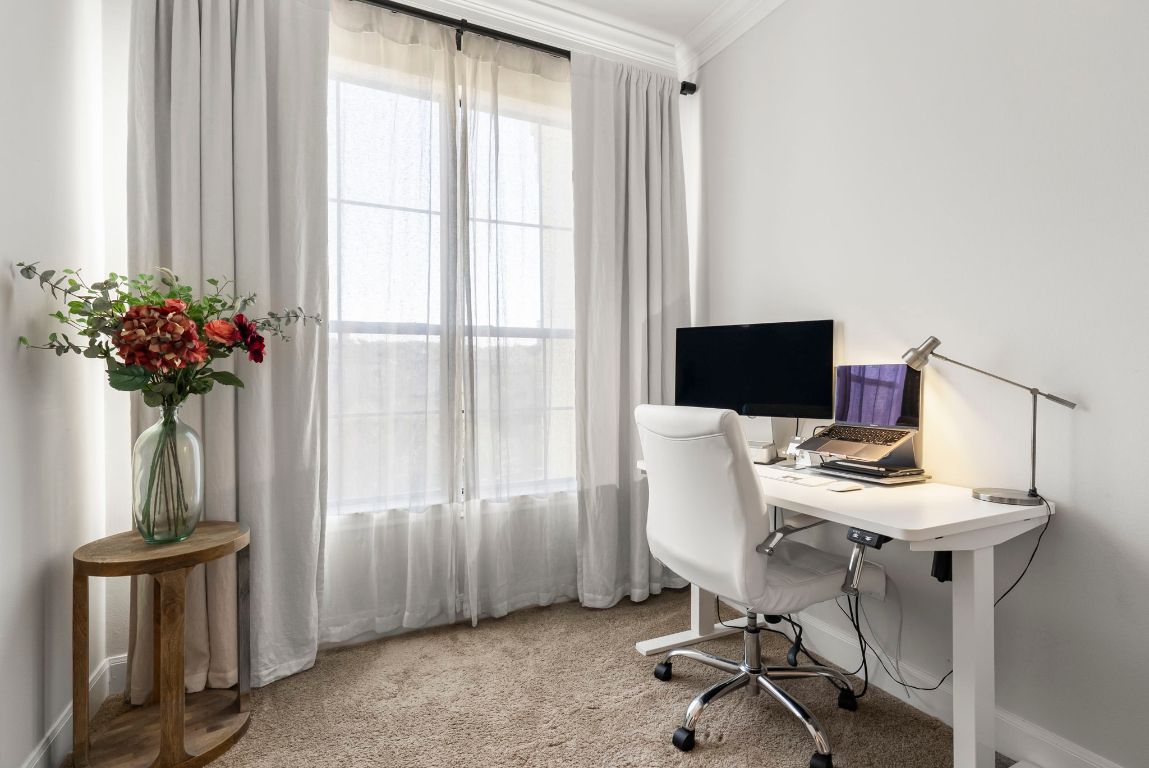 7701 Rialto Boulevard, Unit 1426 Austin, TX 78735 - Photo 11 of 29 a workspace with furniture and a window