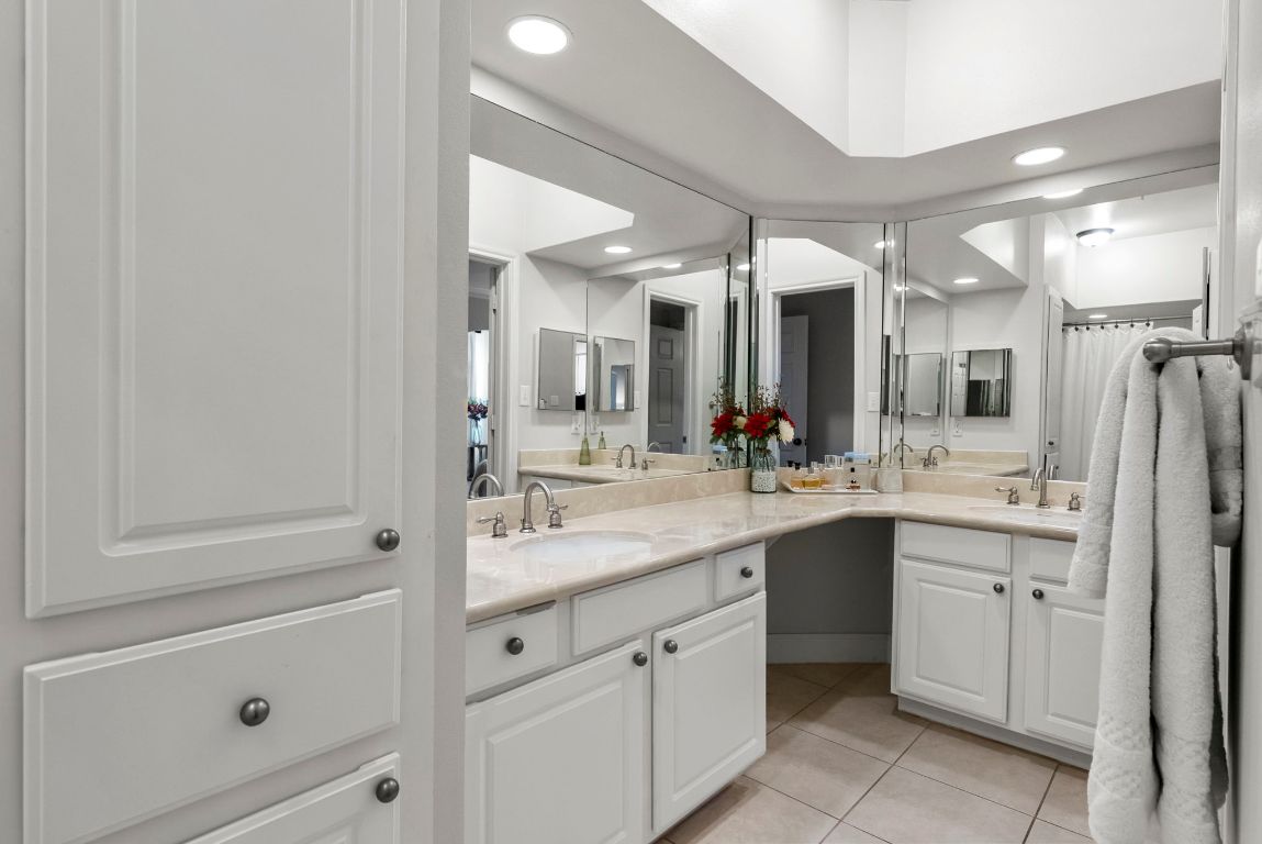 7701 Rialto Boulevard, Unit 1426 Austin, TX 78735 - Photo 13 of 29 a spacious bathroom with a shower sink and mirror