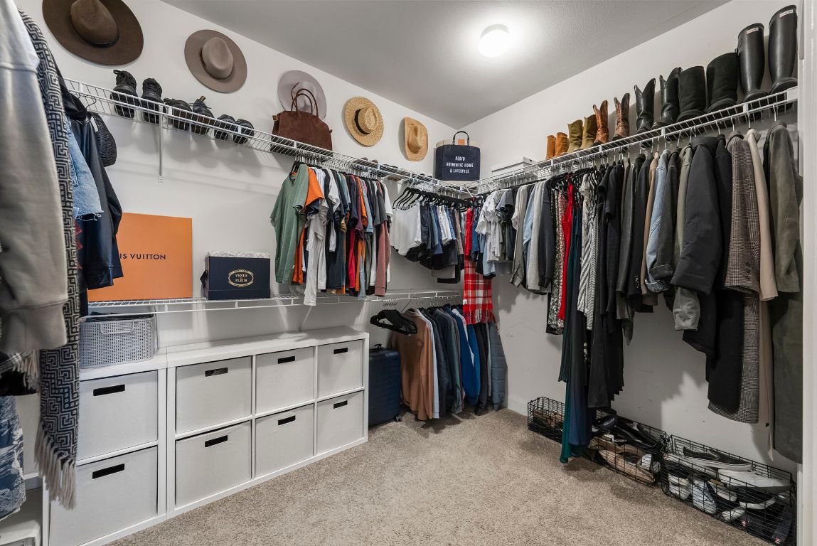 7701 Rialto Boulevard, Unit 1426 Austin, TX 78735 - Photo 15 of 29 a view of walk in closet with clothes and shoes