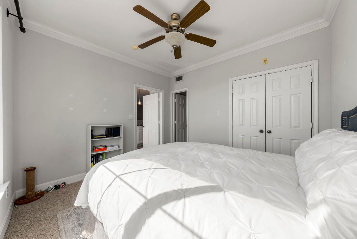 7701 Rialto Boulevard, Unit 1426 Austin, TX 78735 - Photo 21 of 29 a bedroom with a bed and a flat screen tv