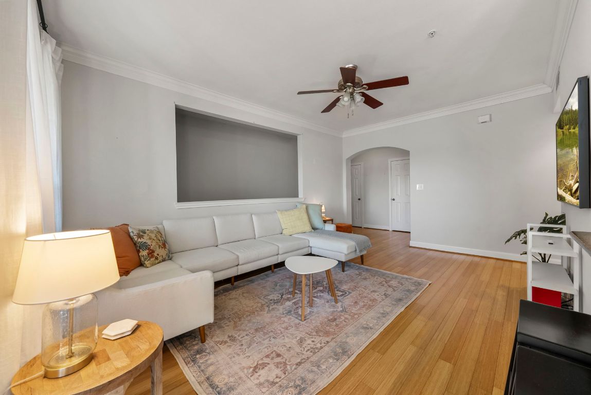 7701 Rialto Boulevard, Unit 1426 Austin, TX 78735 - Photo 22 of 29 a living room with furniture and a wooden floor